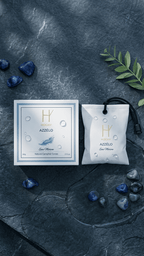 Car perfume sachet containing aqua fragrance oil and camphor to be use in car as car air freshener with box packaging indicating the name azzelo made by hogny
