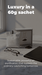 Product packaging with text 'Luxury in a 60g sachet' on a marble surface, depecting the raw natural camphor car perfume power with oud essence.