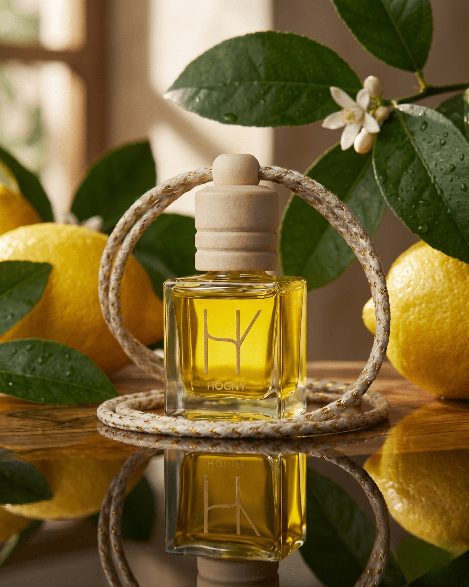 Lemon car perfume with lemon background indicating citrus based oil used in car perfume made by hogny named as Limone Fresco