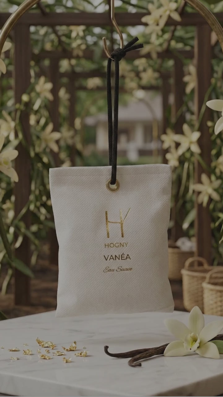 Vanea vanilla camphor car perfume hanging showing its minimal elegant design. and flowers natural indicating the natural fragrance of the product.